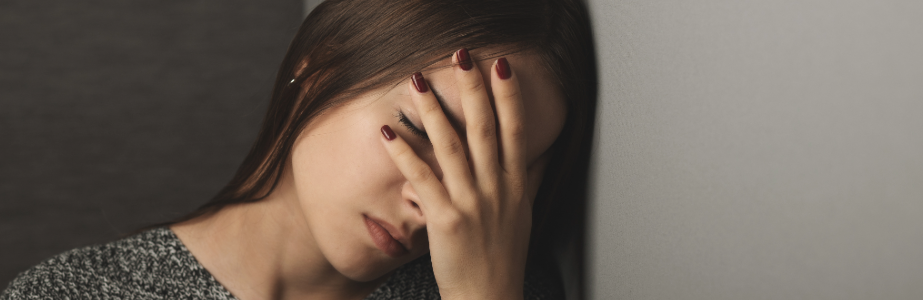 Student with their hand on their face